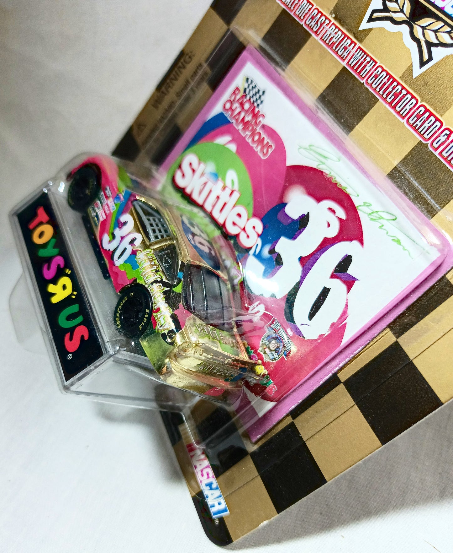 Racing Champions ToysRUs 1998 Ernie Irvan Wildberry Skittles Pontiac - TulipStuff